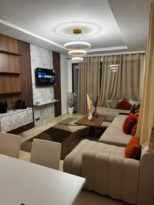 a living room with a couch and a table at Murcia in Rabat