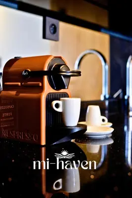 a coffee maker with a cup on a counter at hamy - 1br - Downtown Casablanca in Casablanca
