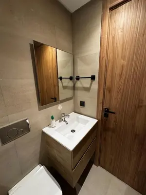 a bathroom with a sink and a toilet and a mirror at Studio 14 in Casablanca