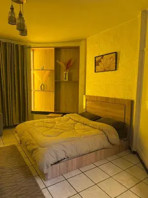 a bedroom with a large bed in a room at Fatine