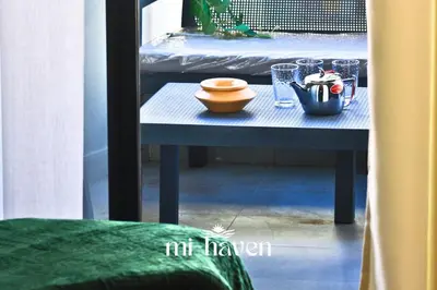 a table in a room with a bed and a table with a bowl at Hamma - 1 BR - Premium condo in Casablanca