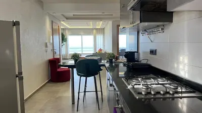 a kitchen with a stove and a counter top at Apartment with impressive sea view! in Rabat