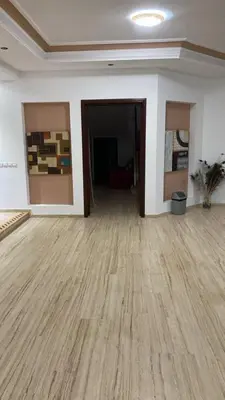 an empty room with a wooden floor in a building at Big Villa In Rabat in Rabat