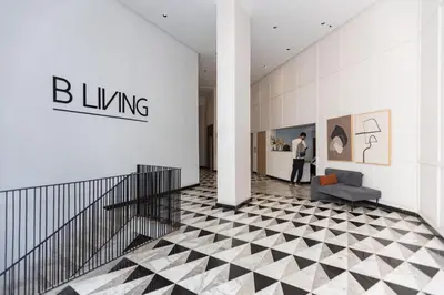 a man standing in the lobby of a building at B-living Luxury studio Maarif palmier in Casablanca