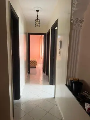 a hallway with a hallway leading to a room at Appart Tamaris DARB in Dar Bouazza