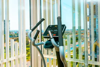 a gym with a view of a city at Cosy Flat for Business Trip at CFC - Infinity Pool in Casablanca