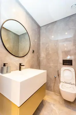 a bathroom with a sink and a toilet at Cosy Flat for Business Trip at CFC - Infinity Pool in Casablanca
