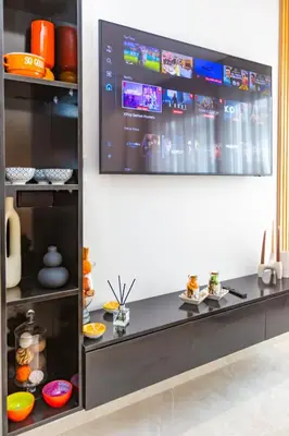 a kitchen with a large screen on the wall at M Studio cosy princesses in Casablanca