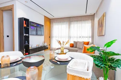 a living room with a table and a couch at M Studio cosy princesses in Casablanca