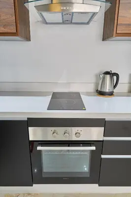 a kitchen with a stove and a kettle on a counter at Luxueux Appartement Sécurisé in Casablanca