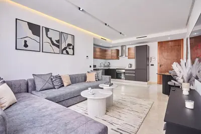 a living room with a couch and a table at Luxueux Appartement Sécurisé in Casablanca