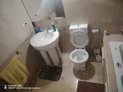 a small bathroom with a toilet and a sink at Apparttement BOUCHRA in Casablanca