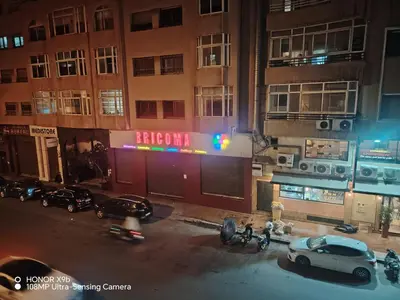 a car parked in front of a building at night at Appartement 2 mars in Casablanca