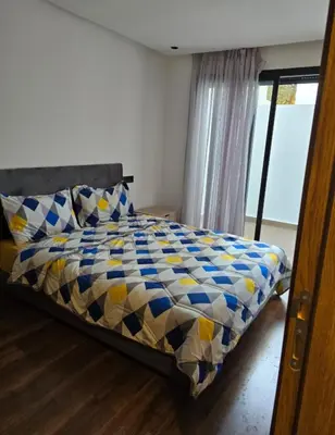 a bedroom with a bed with a blue and yellow at CASA Opal - Downtown Luxury Homes in Casablanca