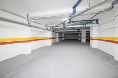 an empty parking garage with colorful lines on the wall at Magnificent apartment 2 in Casablanca