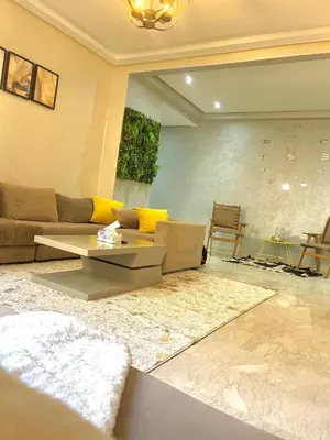 a living room with a couch and a table at Taj collection 1 in Casablanca