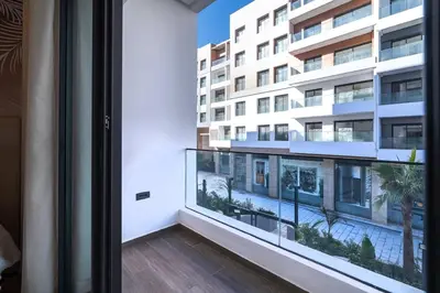 a balcony with a view of a building at Luxurious 2BR 2BA For Families and groups in Casablanca