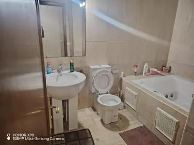 a bathroom with a sink and a toilet and a tub at Apparttement BOUCHRA in Casablanca