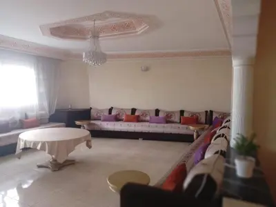 a living room with a couch and a table at Joli appartement bien équipé-Casablanca in Casablanca