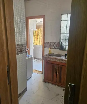 a kitchen with a sink and a counter top at Hassan in Rabat