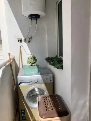 a washing machine in a room with a window at Casablanca Stay in Casablanca