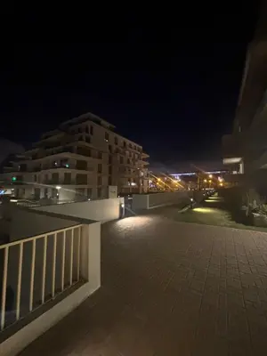 a view of a building at night with lights at Appartement 1 chambre à rabat imkan in Rabat