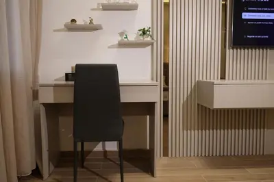 a white desk with a black chair in a room at Premium Studio near Agdal Train Station in Rabat