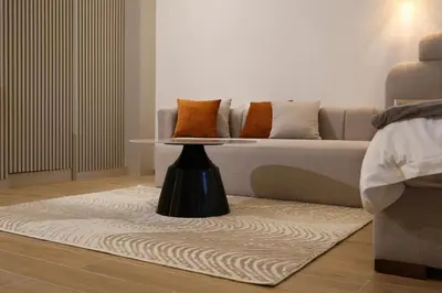 a living room with a couch and a table at Premium Studio near Agdal Train Station in Rabat