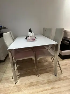 a dining room table with chairs and a box on it at 9 Rue d'Alger Casablanca in Casablanca