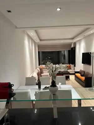 a living room with a glass table and a couch at 9 Rue d'Alger Casablanca in Casablanca