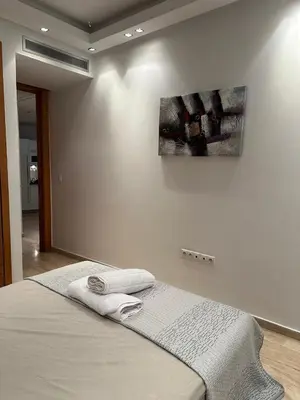 a bedroom with a bed and a painting on the wall at 9 Rue d'Alger Casablanca in Casablanca