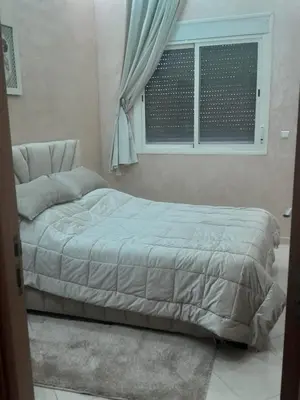a bed in a bedroom with a window at Magnifique T2 à Skhirat in Skhirat