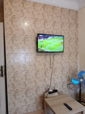 a flat screen tv hanging on a wall at Cambre à louer in Casablanca