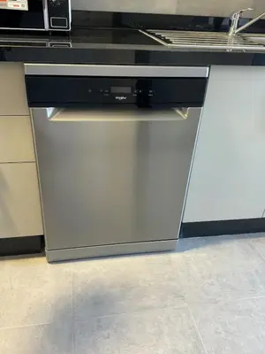 a dishwasher sitting under a counter in a kitchen at Agdal Gare View Apartment in Rabat