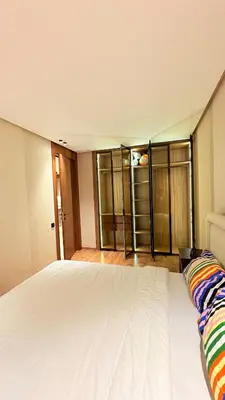 a bedroom with a large white bed in a room at stylish studio located in centre of casablanca in Casablanca