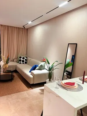 a living room with a couch and a table at stylish studio located in centre of casablanca in Casablanca