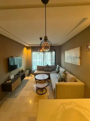 a living room with a couch and a table at Calme et Comfort ,cozy, centre de Casablanca in Casablanca