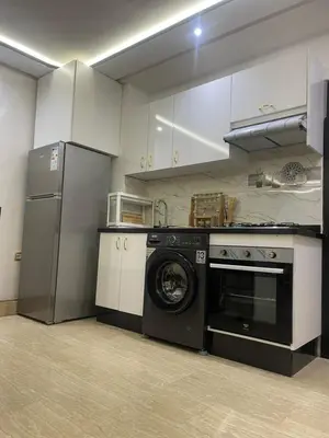 a kitchen with a washing machine and a refrigerator at Studio Chic & Neuf au Cœur de Bourgogne in Casablanca-Port