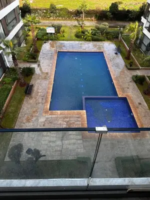 an overhead view of a swimming pool in a building at appartement de luxe a Mansouria in Mansouria