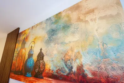 a painting on a wall with two vases on a shelf at Modern CFC Flat with Terrace Gym & City Views in Casablanca