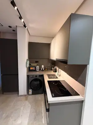 a kitchen with a sink and a stove top oven at Luxury Studio Casa Center in Casablanca