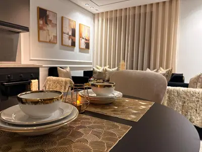 a dining room with a table with dishes on it at Jolie studio plein centre Casablanca in Casablanca