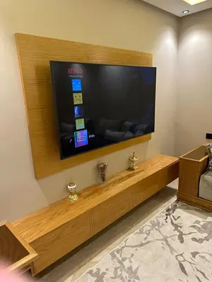 a living room with a large flat screen tv at Élégant & Spacieux - Résidence Sécurisée à Témara in Temara