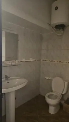 a bathroom with a toilet and a sink at Stunning 2 bedrooms flat Palmier in Casablanca