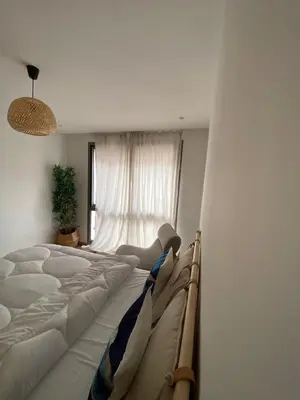 a bedroom with two beds and a window at Private Room,Piscine & Parking en cohabitation avec le hôte seulement à 6 min Airport MohamedV in Nouaceur