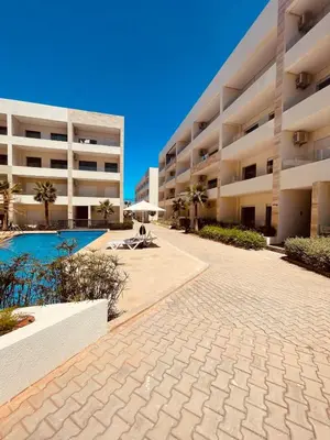 a large apartment building with a swimming pool at El Mansouria Mohammedia, Magic House T5 in Mansouria