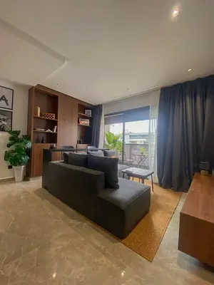 a living room with a couch and a table at Luxury 1BR CFC with Pool, Balcony & City View in Casablanca