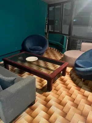 a living room with a couch and a coffee table at Agdal Rabat superb furnished modern studio with large terrace in Rabat