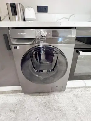 a washing machine in a kitchen with a counter at anfa park residence beau living park in Casablanca