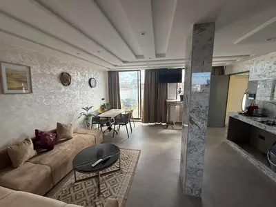 a living room with a couch and a table at studio elevator, renovated air-conditioned breakfast in Casablanca
